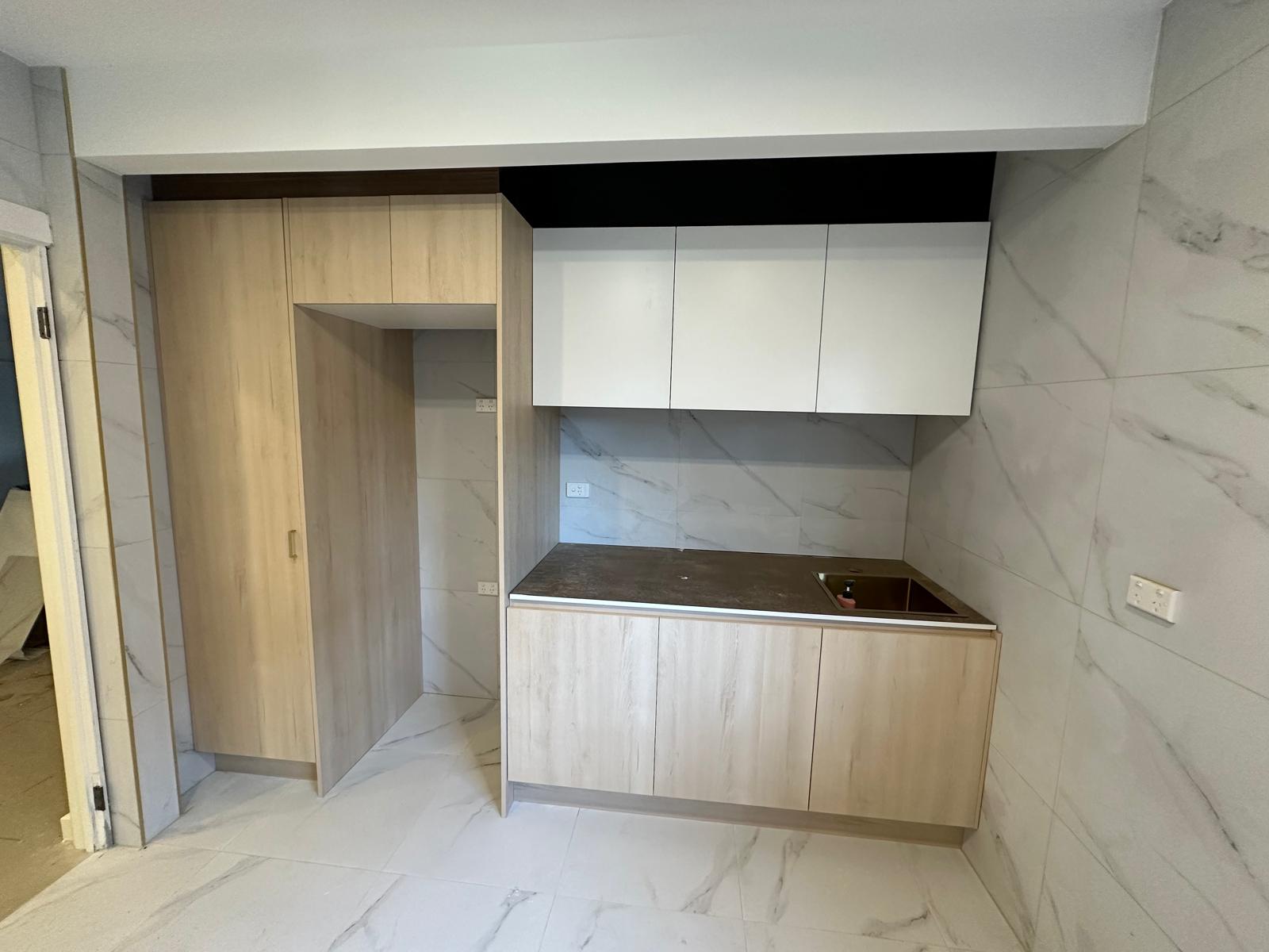 Modern dual-tone kitchen cabinetry with integrated design.